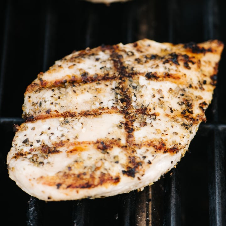 A grilled chicken breast on a grill.