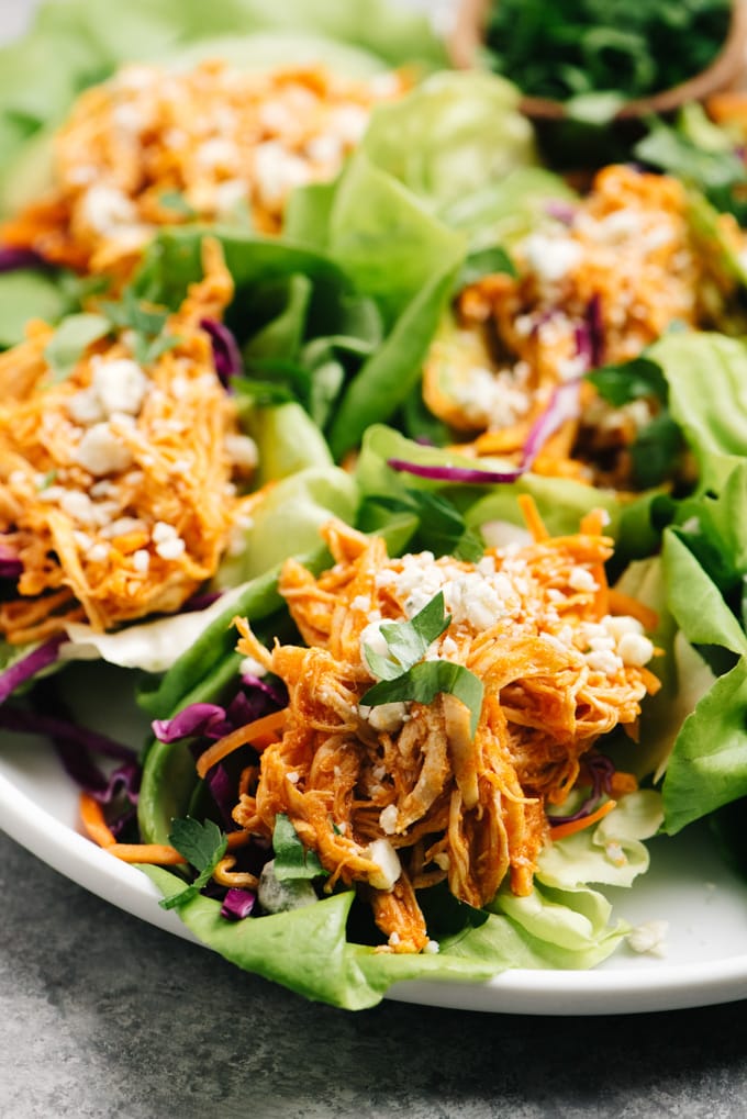 Buffalo chicken lettuce wraps arranged on a platter.