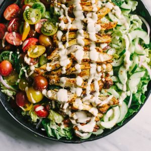 This recipe for chicken shawarma salad is a flavorful, fresh, easy weeknight dinner. Each bite is crisp, bright, and bursting with flavor. This is the perfect whole food summer weeknight dinner recipe! #healthy #wholefood #realfood #eatclean