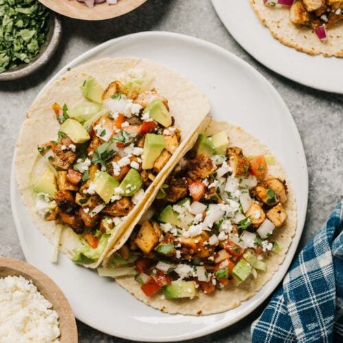 A plate of grilled chicken tacos.