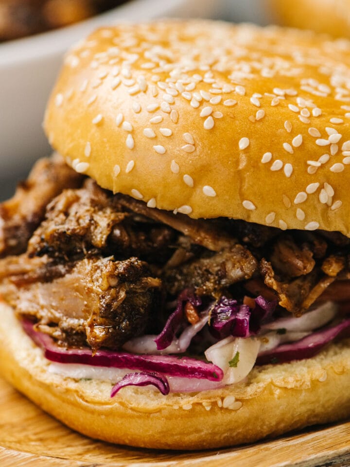 Side view, pulled pork cooked in the oven on a brioche bun with coleslaw.