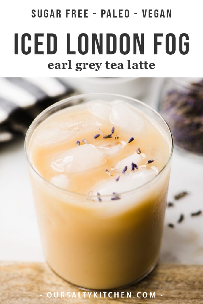 Iced london fog earl grey tea latte in a glass with fresh lavender leaves.