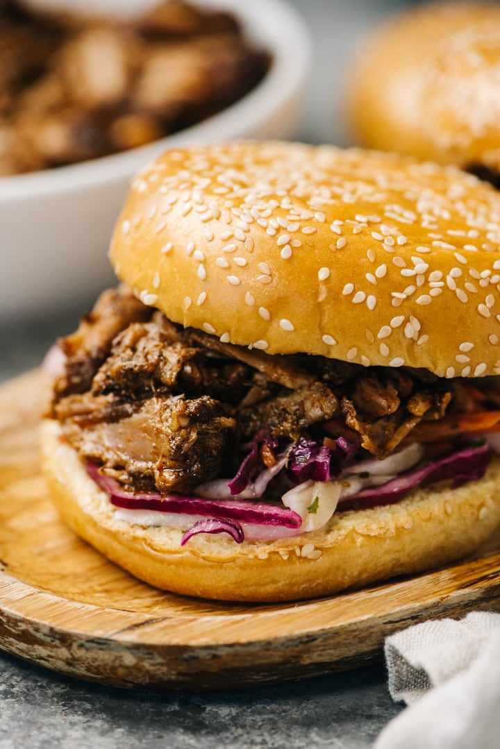 Side view, pulled pork cooked in the oven on a brioche bun with coleslaw.