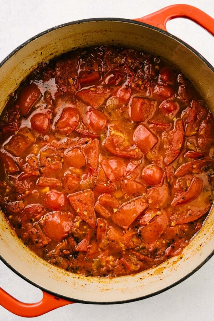 Fresh tomato soup in a dutch oven after simmering for 1 hour and before being pureed.